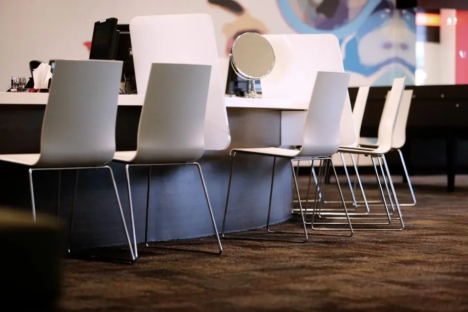 Styling chairs and mirrors at a salon's workstations