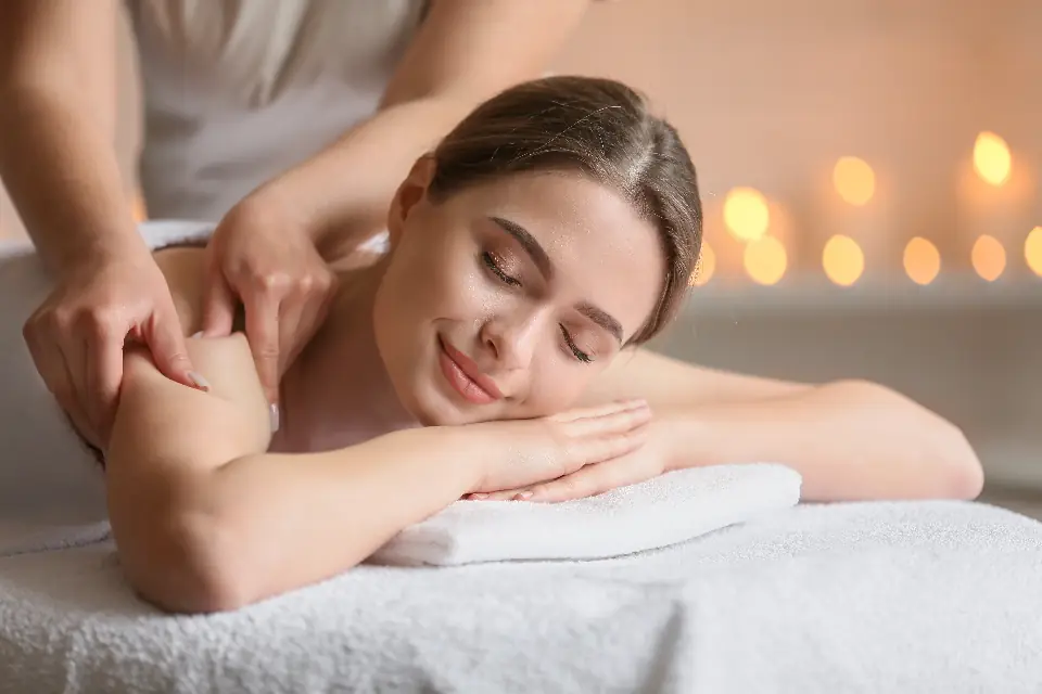 A client relaxing during a back massage at a spa